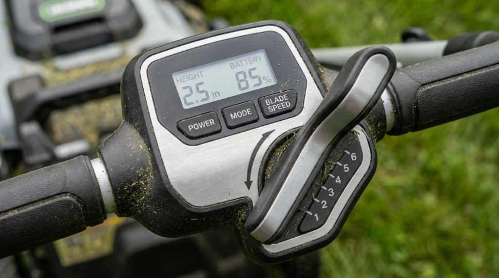 Close-up of the electric lawn mower height adjustment lever and start button.